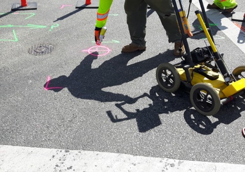 Man marking parts of a road where utilities will be, part of Utility Contracting in East Peoria IL