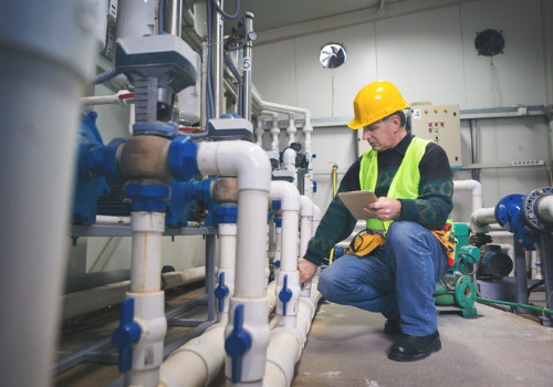 Contractor inspecting a facility's Commercial Plumbing